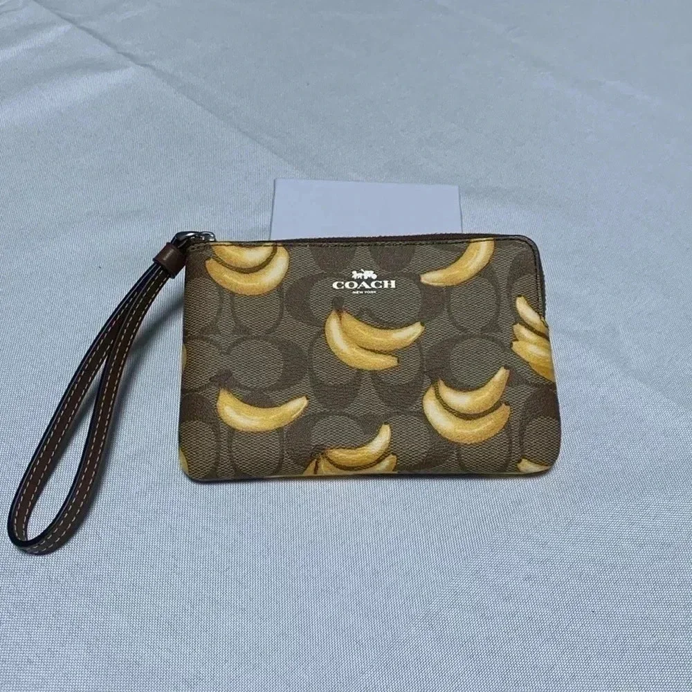 COACH Wristlet, Banana Print. NWT.